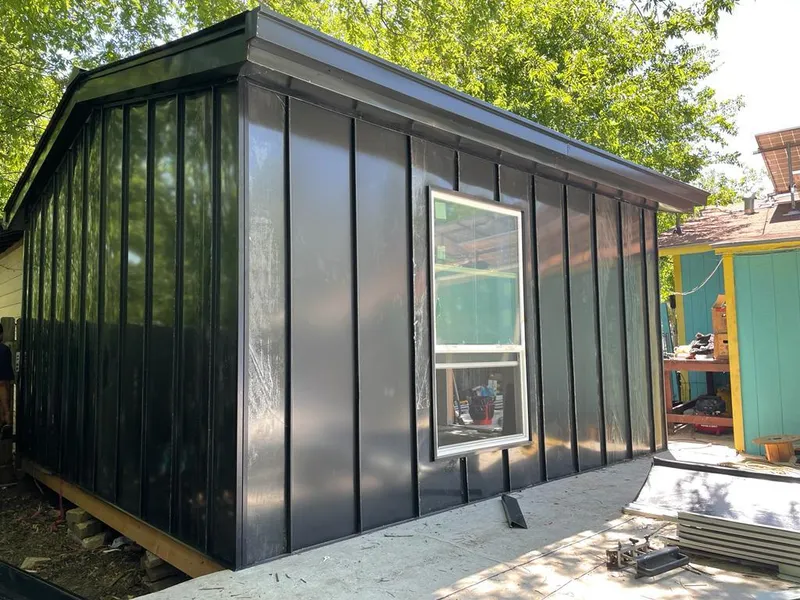 Black standing seam metal wall panels for Roof Inspection in Alden