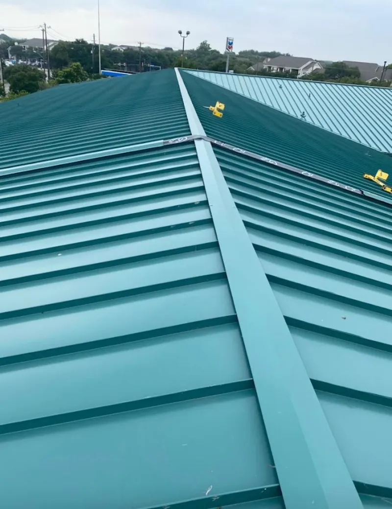 Green commercial metal roof ridge and valley for Metal Roof Repair in Alden